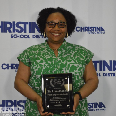 Photo of Tia Live-Joseph Teacher of the Year Pulaski Early Education Center holding award